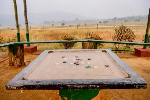 Outdoor carrom board overlooking the natural landscape